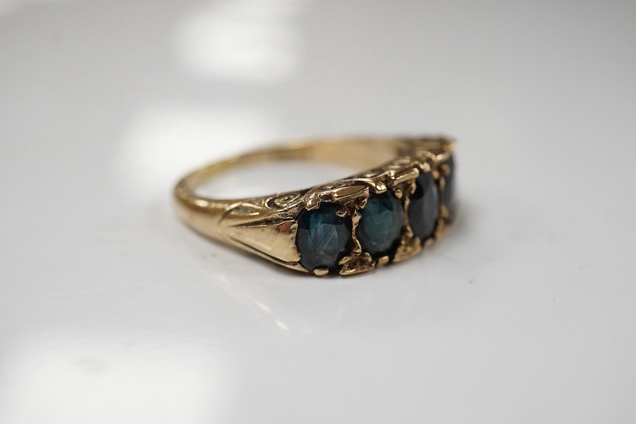 A 1970's Victorian style 9ct gold and graduated five stone sapphire set half hoop ring, size Q, gross weight 5.6 grams. Condition - fair to good